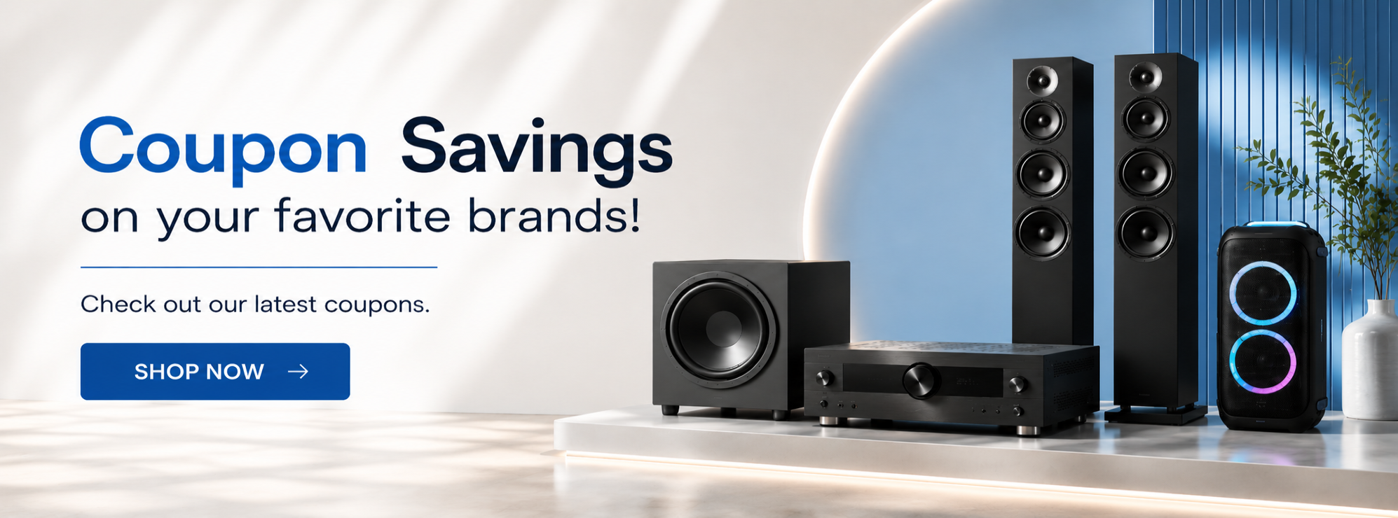 Promotional banner for speaker brands featuring a black multi-speaker home theater setup on a white and blue studio background with text reading 'Coupon Savings on your favorite brands!' and a blue 'SHOP NOW' button.